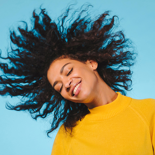 Young woman tossing hair Young woman tossing hair
